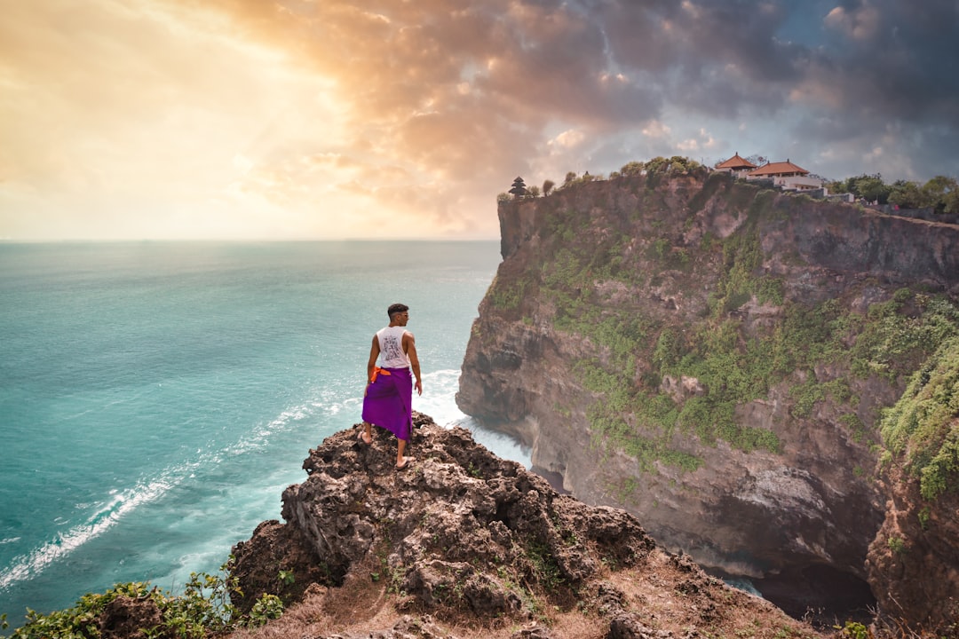Bali beach and cliffside travel view in Indonesia